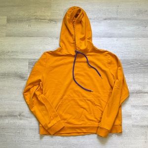 Cropped orange hoodie with complementary blue cord
